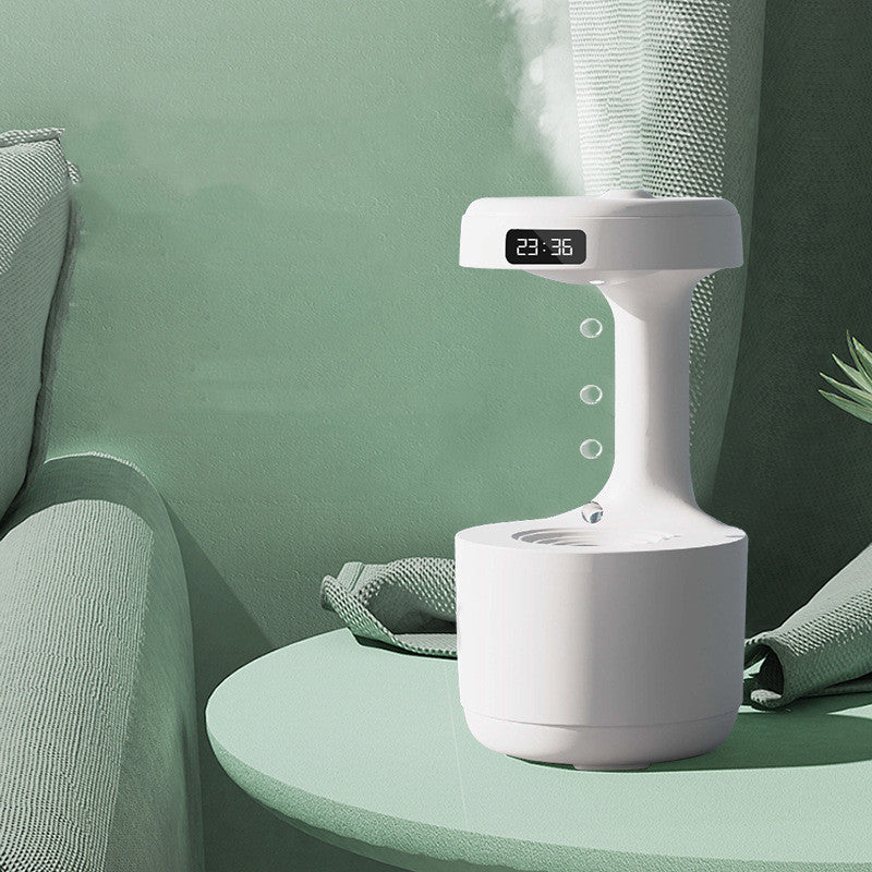 Shopi Vella large capacity aroma diffuser in white on green table emitting mist in living room