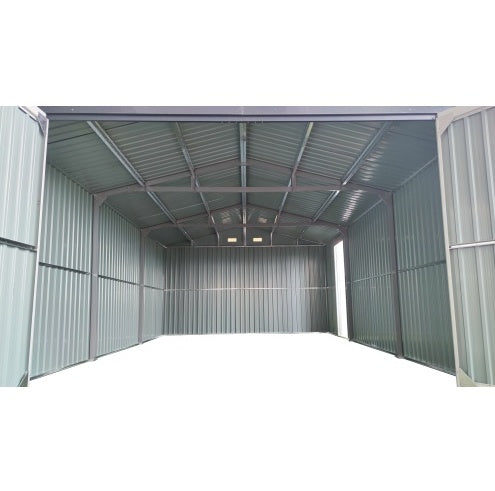 Interior view of a large outdoor storage shed with metal walls and roof by Shopi Vella