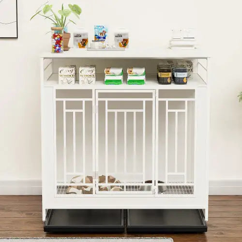 White large wooden dog kennel furniture with storage shelves and two black pull-out trays on wooden floor