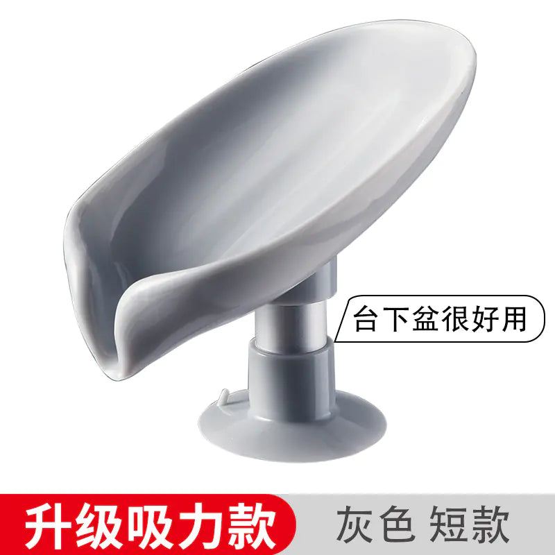 Gray leaf shaped soap holder with suction base for bathroom sink organization