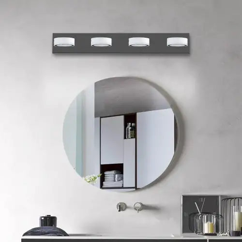 Modern LED bathroom wall light 4 bulbs mounted above round mirror in contemporary bathroom