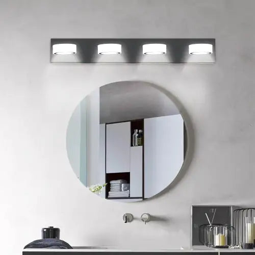 Modern LED bathroom wall light 4 bulbs above round mirror in minimalist bathroom