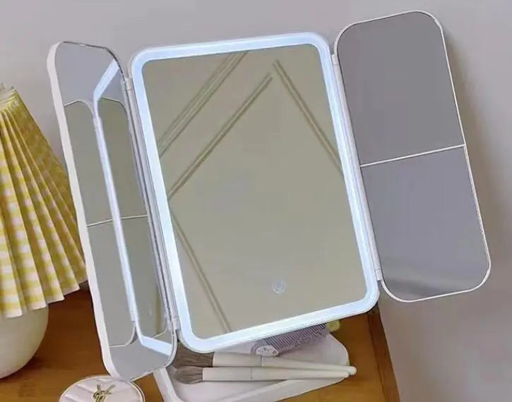 LED makeup mirror with lights featuring three adjustable panels on a wooden surface