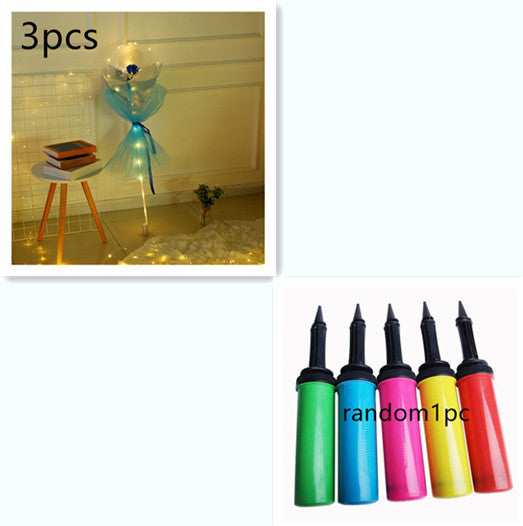 LED rose balloon bouquet with blue wrapping and light string next to colorful balloon pumps