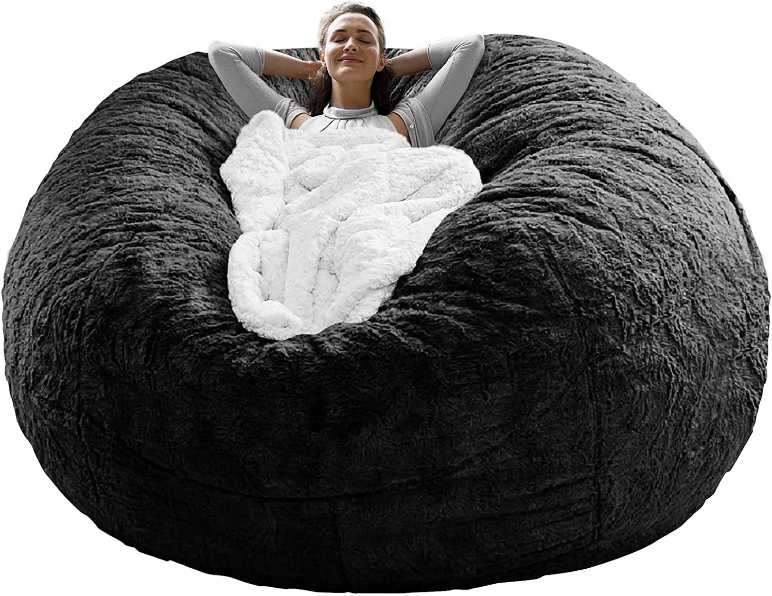 Cozy black living room bean bag cushion cover with a person relaxing wrapped in a white blanket