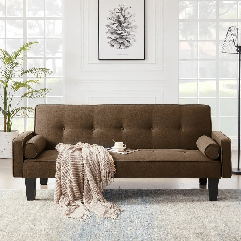 Shopi Vella brown living room sofa with pillows and a throw blanket in a bright modern space