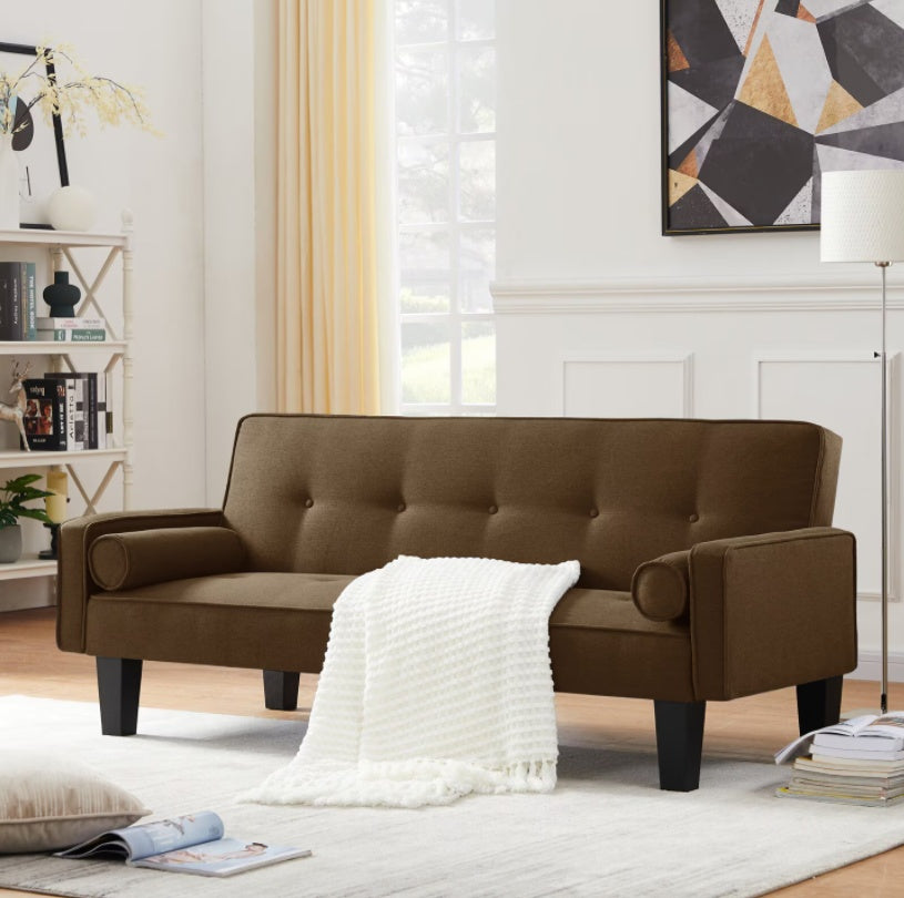 Shopi Vella brown living room sofa with pillows and white throw in a bright modern living room