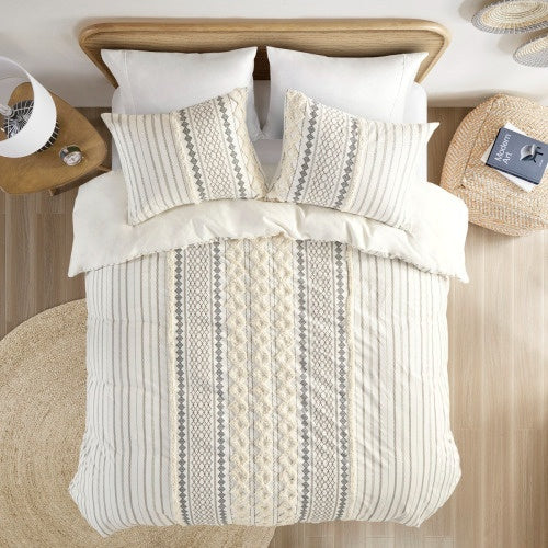 Luxury cotton duvet set with chenille in neutral tones featuring intricate patterns on bed