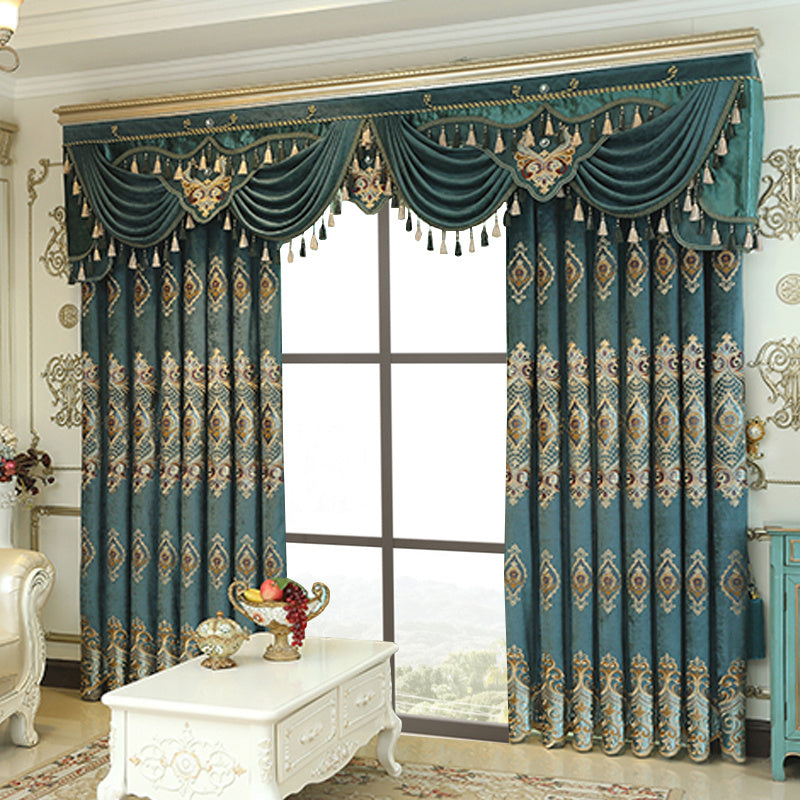Shopi Vella luxury embroidered velvet curtains in teal with ornate gold and cream patterns and tassel valance