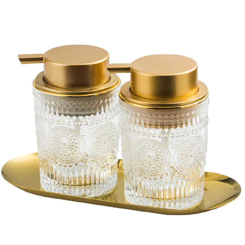 Luxury glass soap dispenser set with gold pump and matching container on gold tray
