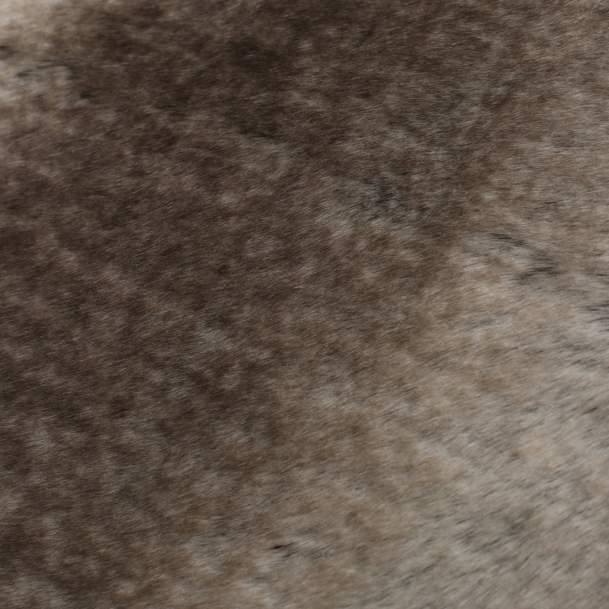Close-up texture of Shopi Vella luxury living room blanket with soft brown and gray fur-like surface