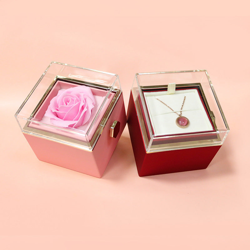 Soap flower jewelry packaging with pink rose and necklace display in clear lid storage boxes