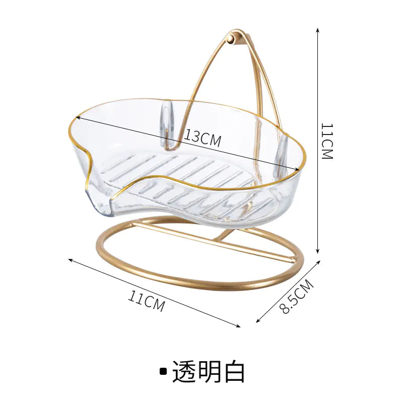 Luxury soap holder with drainage in clear design and gold-tone stand measuring 13 by 11 by 8.5 centimeters