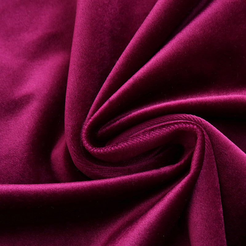 Close-up of rich purple luxury velvet blackout curtains fabric from Shopi Vella with soft texture
