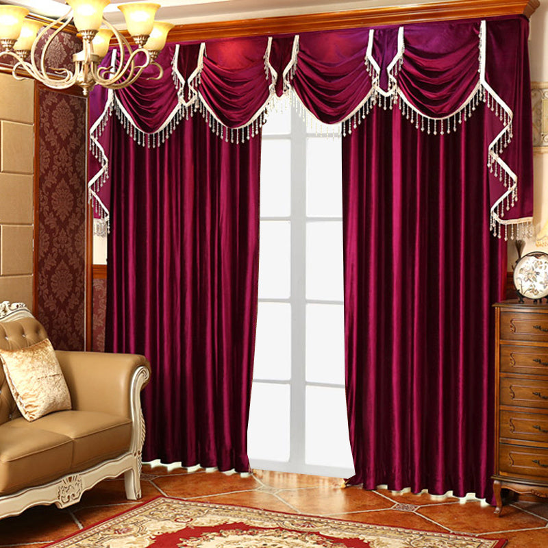 Shopi Vella luxury velvet blackout curtains in deep burgundy with decorative valance and tassels in elegant living room