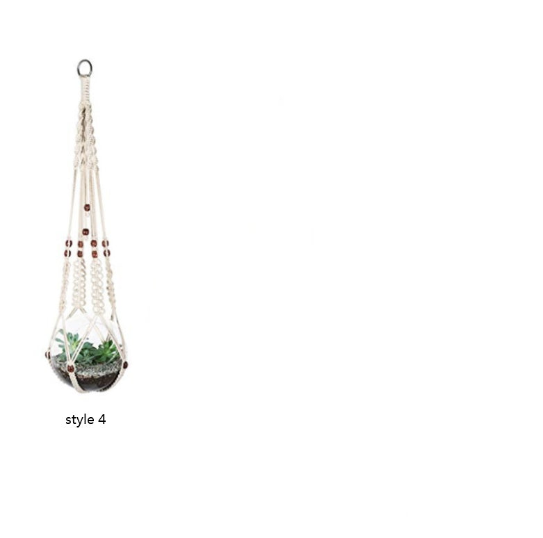 Shopi Vella macrame hanging plant holders for home with wooden beads and a small green plant inside