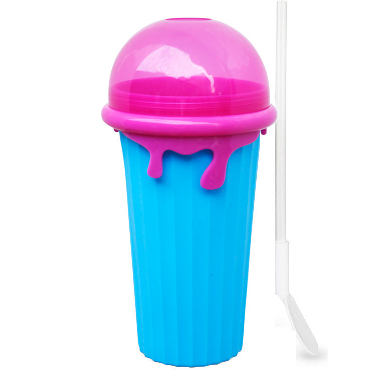 Shopi Vella magic slushy maker cup in blue and pink with a dome lid and a white straw spoon