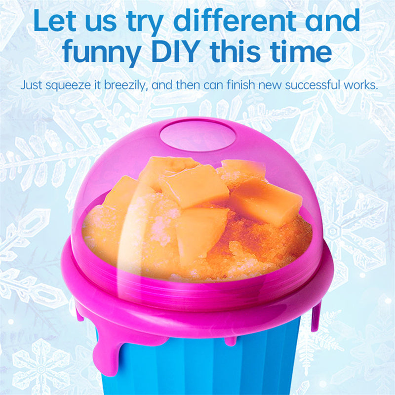 Shopi Vella magic slushy maker cup in blue and pink with orange slushy and ice cubes inside