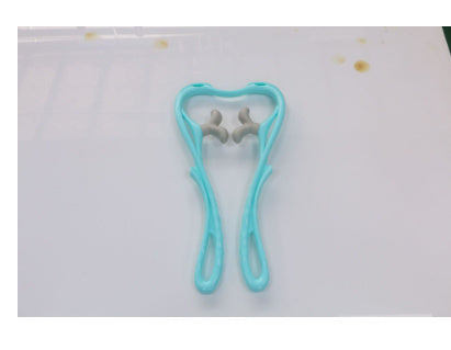 Shopi Vella manual neck massager tool in blue with ergonomic handles for home use