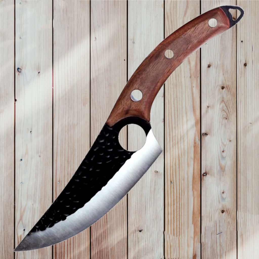 Shopi Vella meat cutting scimitar knife with curved blade and wooden handle on wooden surface