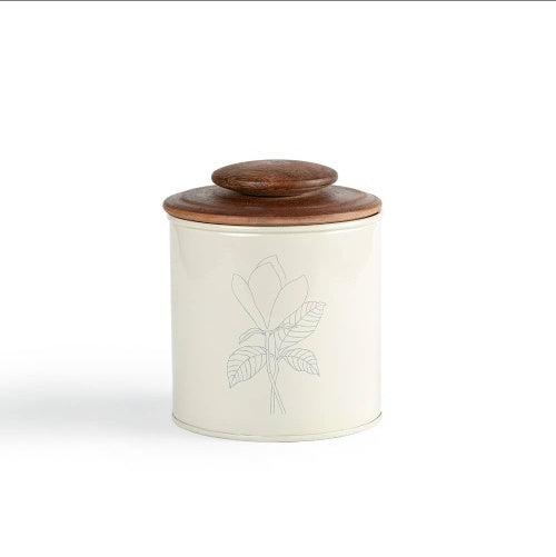 Shopi Vella metal canister with wooden lid featuring a minimalist plant design on cream body