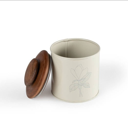Shopi Vella metal canister with wooden lid featuring a floral design and cream finish