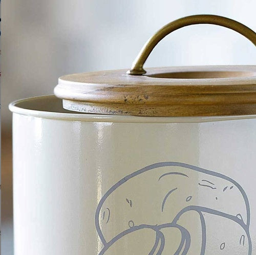 Shopi Vella metal potato storage bin with cream finish and wooden lid with brass handle