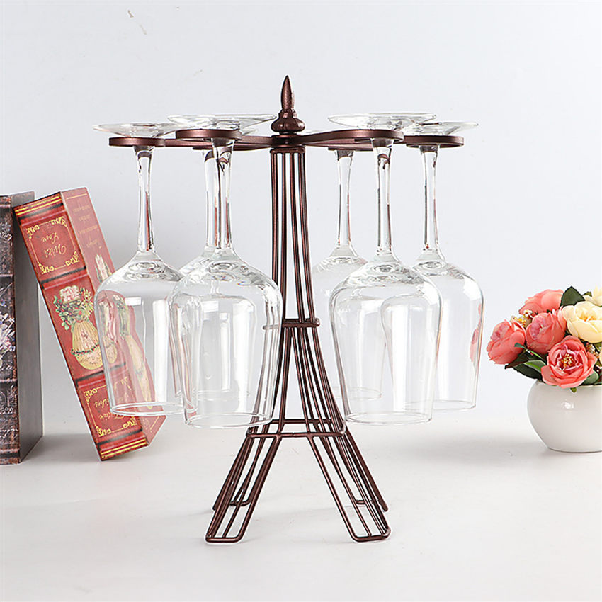 My Store wine glass holder rack in bronze metal holding six upside down wine glasses on a white surface