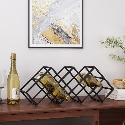 Shopi Vella metal wine storage organizer holding four bottles of white wine on wooden surface