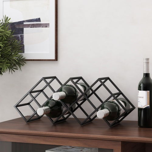 Shopi Vella metal wine storage organizer holding three wine bottles on a wooden surface