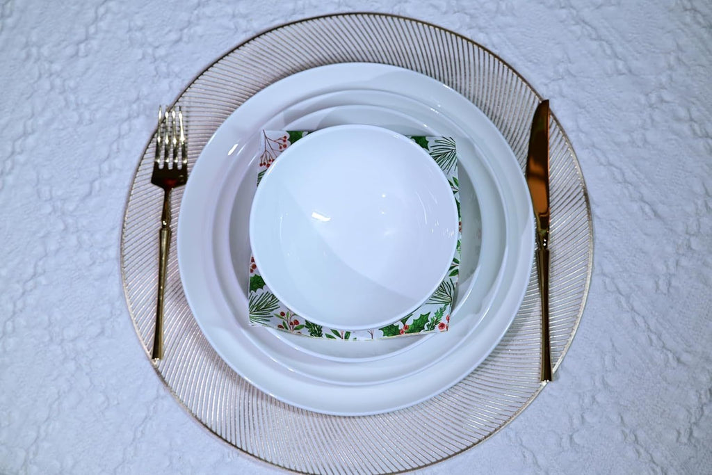 Shopi Vella microwave and dishwasher safe dinnerware set with white plates and bowl on a decorative glass charger