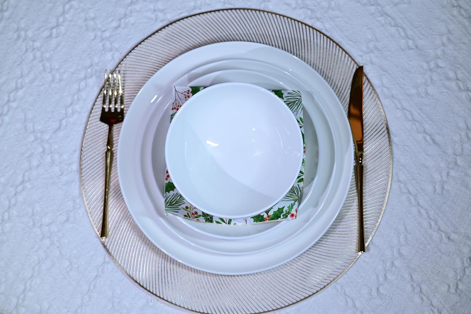 Shopi Vella microwave and dishwasher safe dinnerware set with white plates and bowl on a decorative glass charger