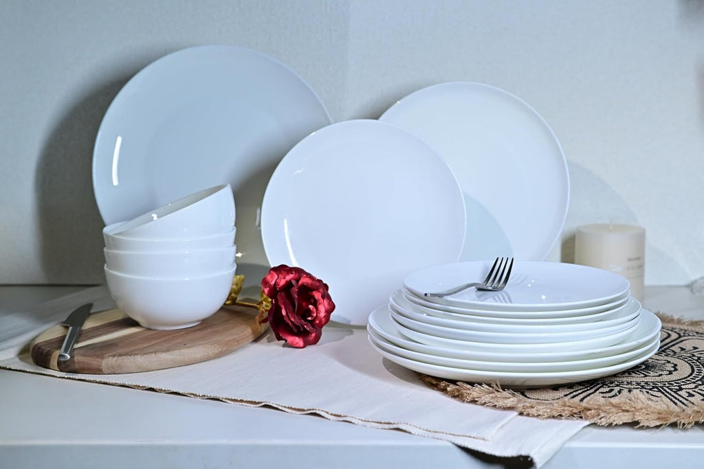 Shopi Vella microwave and dishwasher safe dinnerware set with white plates and bowls arranged on a table