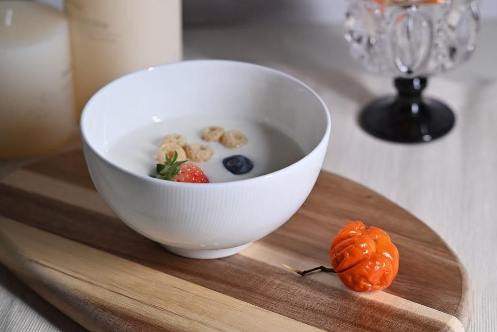 White ceramic bowl filled with cereal and milk on wooden board microwave and dishwasher safe dinnerware