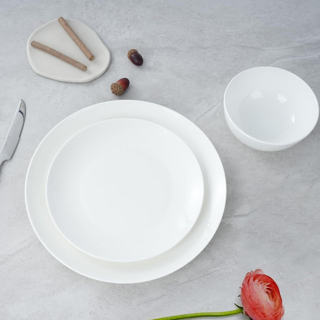 Shopi Vella white microwave and dishwasher safe dinnerware set with plates and bowl on gray surface