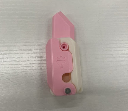 Shopi Vella mini 3D printing toy knife in pink and white designed for safe cutting tasks