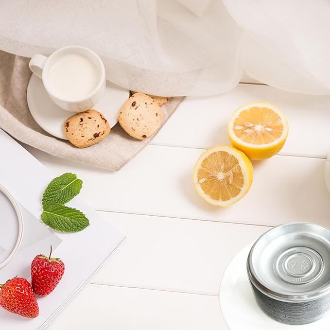 Shopi Vella mini condiment dipping bowls with lemons, strawberries, cookies, and a cup of milk on a white wooden surface