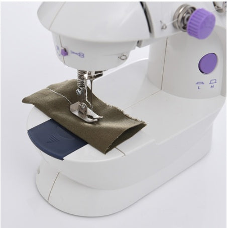 Shopi Vella mini household sewing machine in white with fabric piece for small sewing tasks