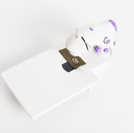Shopi Vella mini household sewing machine with purple accents and extended white work table