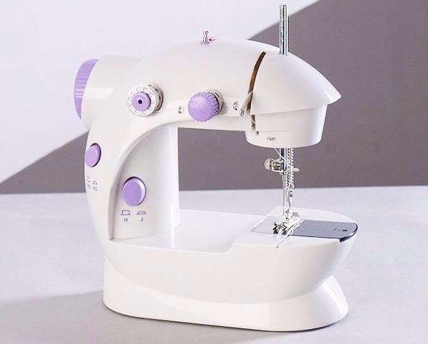 Shopi Vella white and purple mini household sewing machine with compact design and control knobs