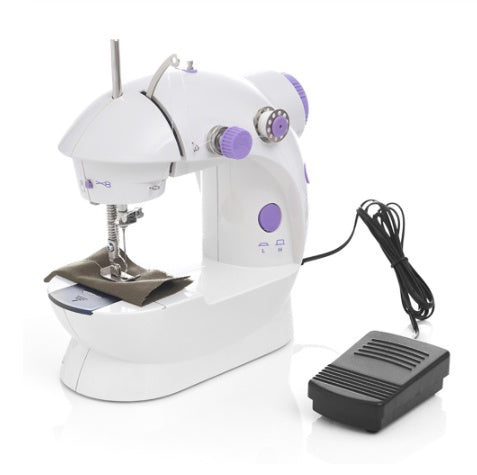 Shopi Vella mini household sewing machine in white and purple with foot pedal and fabric piece