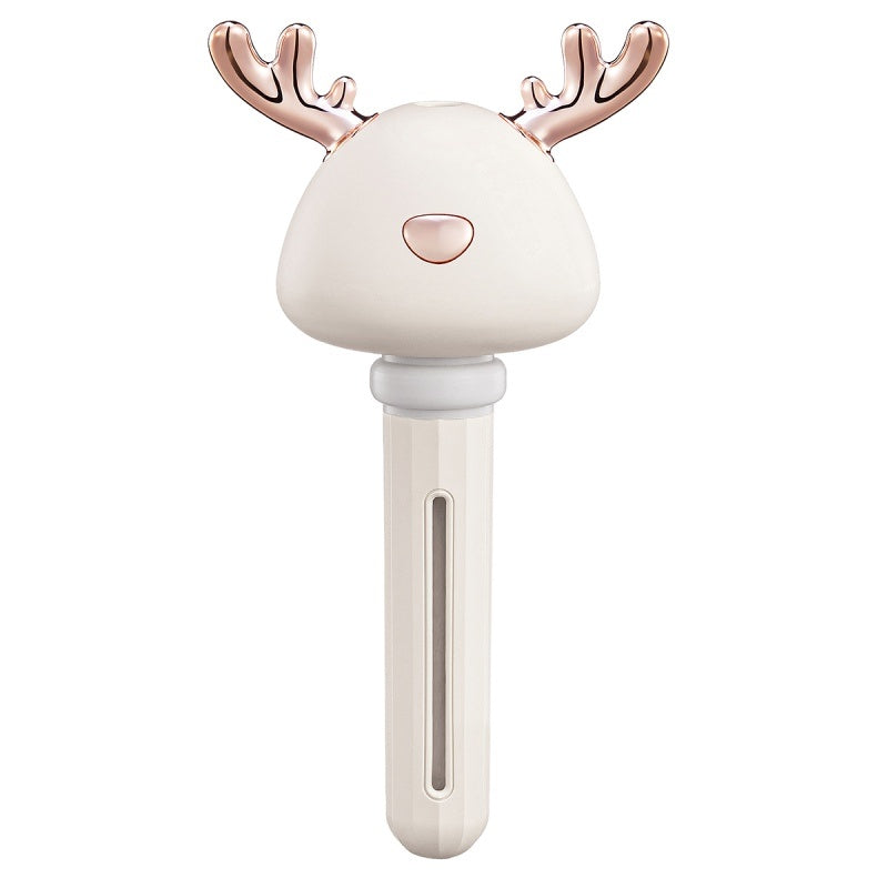 Shopi Vella mini USB humidifier shaped like a white reindeer with rose gold antlers for home storage