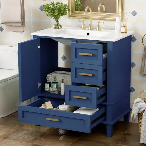 Modern bathroom cabinet with storage in navy blue featuring multiple drawers and open door under sink