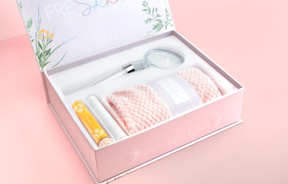 Shopi Vella modern bathroom shower set with showerhead, towel, and bath accessories in a pink gift box