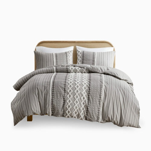 Shopi Vella cotton duvet cover set queen in gray with geometric patterns on bed with wooden headboard