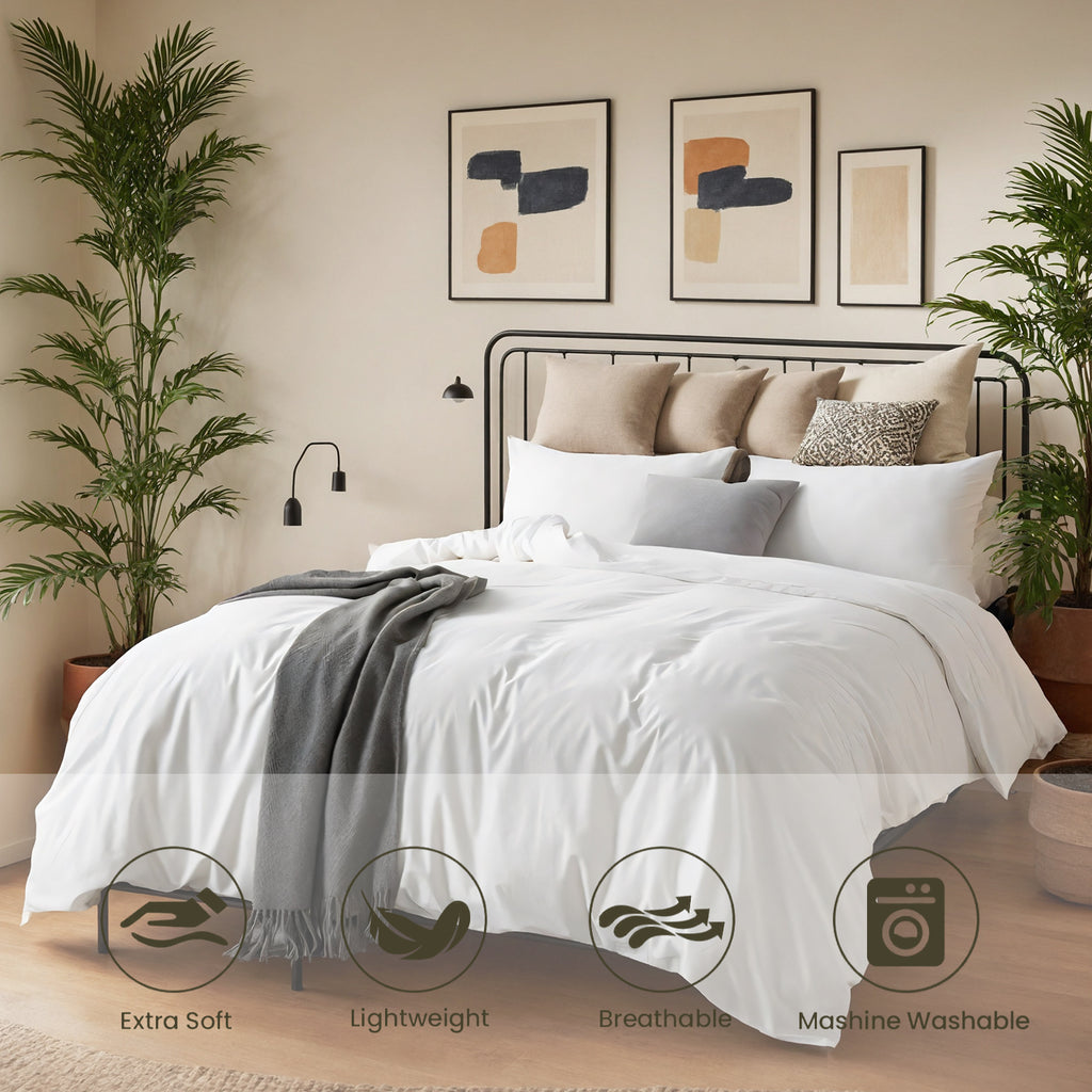 Shopi Vella modern bedroom quilted bedding set in white with pillows and decorative throw in a cozy bedroom