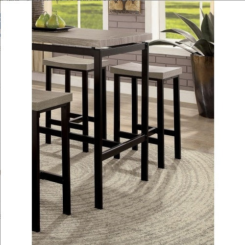 Shopi Vella modern black and gray dining table set with high stools in a sunlit room