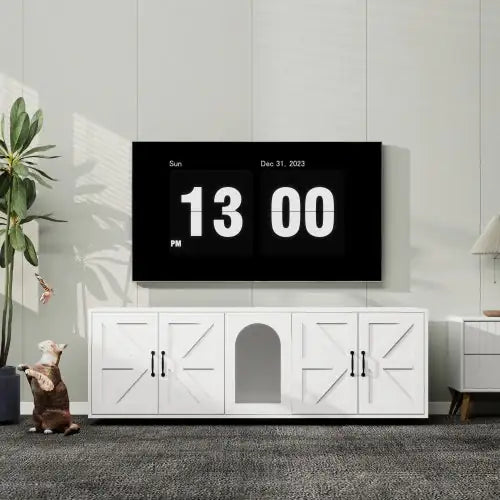 White modern cat litter box furniture with central cat entrance and storage cabinets under wall-mounted TV