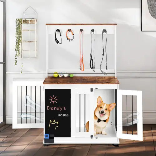 Modern dog crate furniture with white wood finish and storage shelves featuring a happy corgi inside
