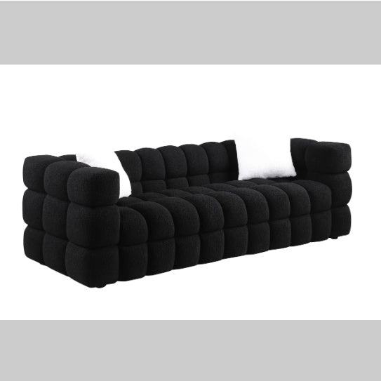 Shopi Vella modern fabric sofa for living room in black with tufted cushioned design and white pillows